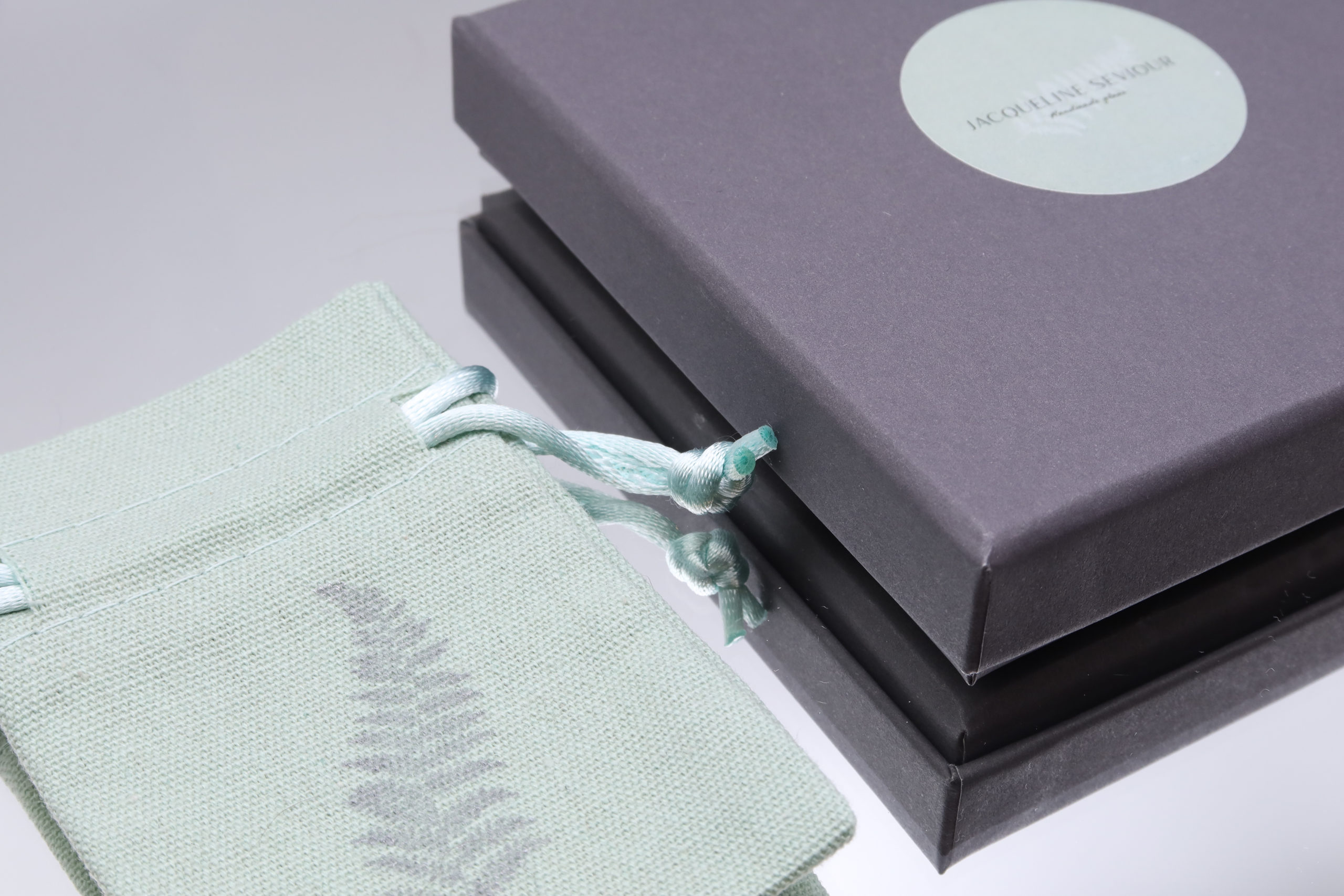 Jacqueline Seviour Glass moorland sea coast surf glass pendants Pouch and Gift Box.jpg